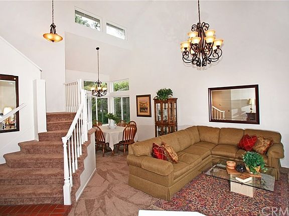 High ceilings and natural light floods this room with an inviting presence