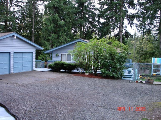 Part of 7 Car Garage and Side of House