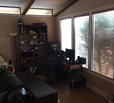 great room/living room with vaulted ceilings