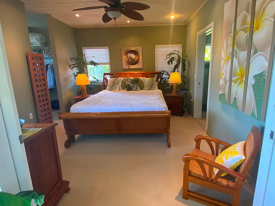 Teak accented bedroom with Cal-King. Walk-in closet to left, bath to right.