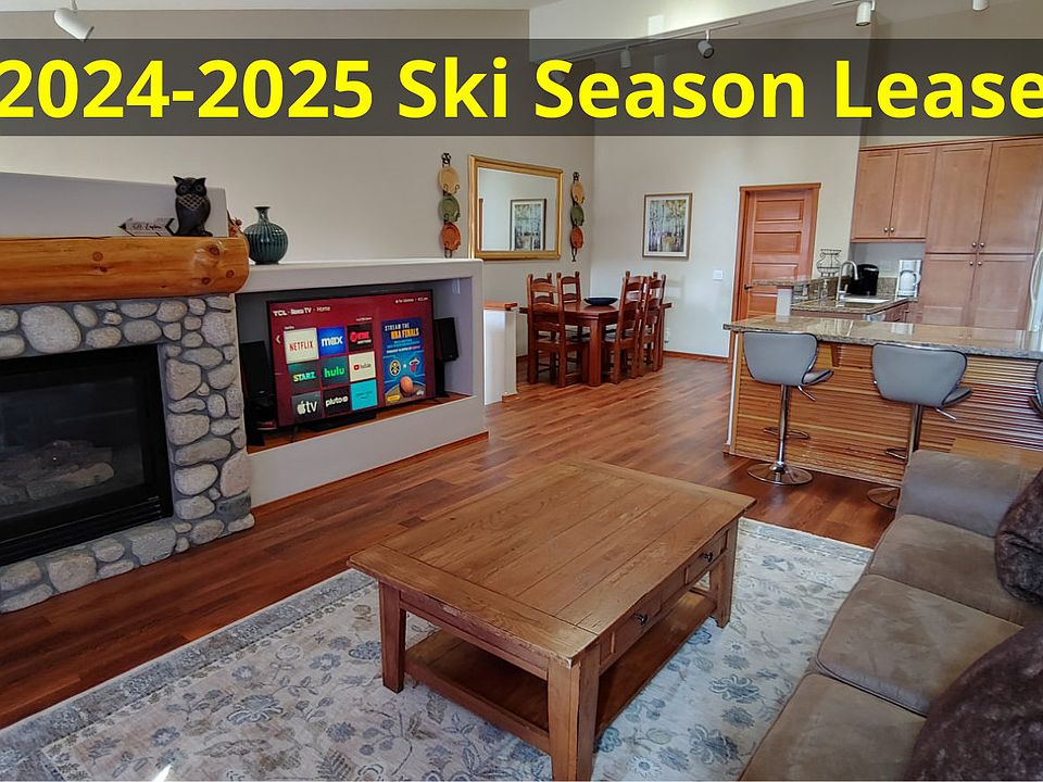 Family Room with fireplace, 55" TV, and Bluetooth speakers.