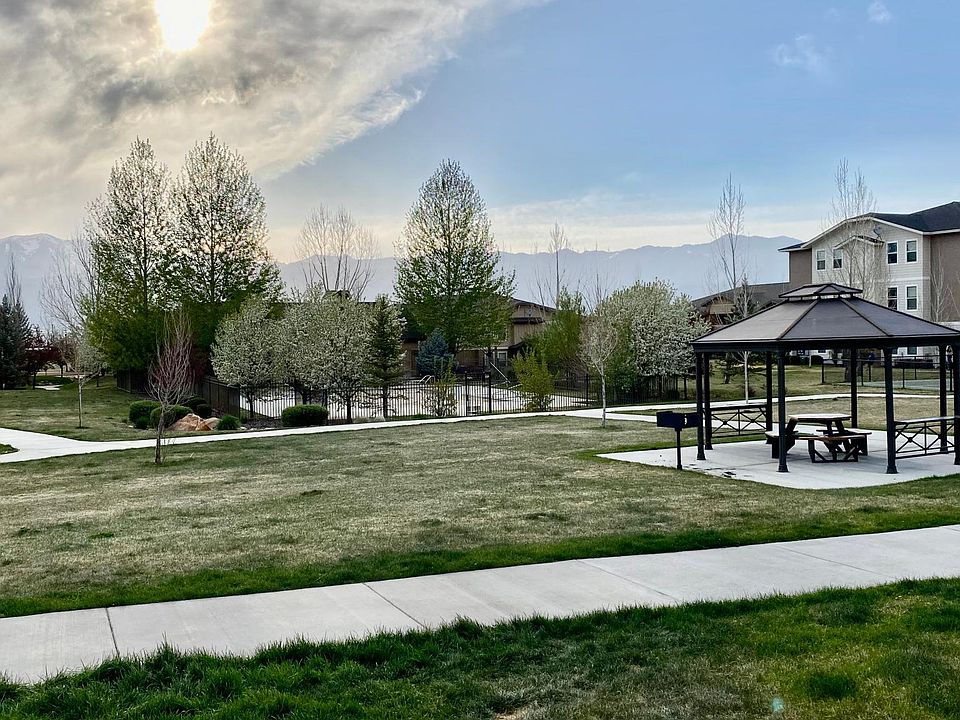 Mountain views from west facing windows (no ugly noisey carports to look at) onto large lawn with pool/pool house, pickleball/basketball court, and playground in the distance.