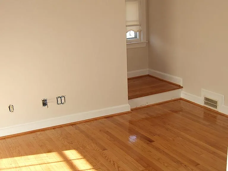 Main floor bedroom to the left, with stairs to second floor around landing.