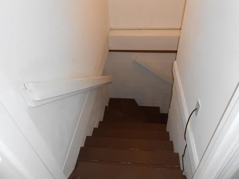 view of steps leading to the basement