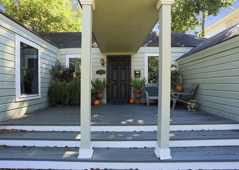 Wonderful large deck graces the front of the property. Great place to "cool your heels" and visit with your neighbors.