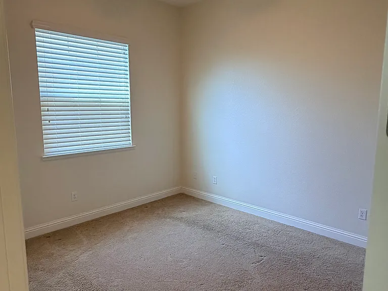 Guest bedroom along side of home