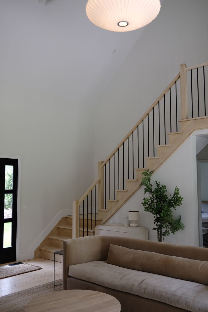  Custom oak staircase leads to the master suite