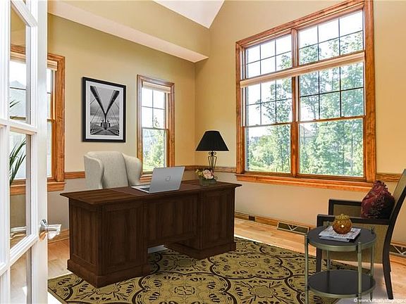 Separated from the welcoming entry via french doors, the fabulous main level office features a vaulted ceiling, wide plank hardw