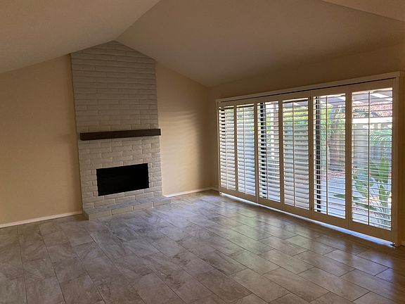 Living Room w/Fireplace & Plantation Style Shutters