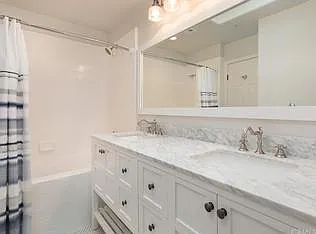Master bath, with dual vanity and subway tiles.
