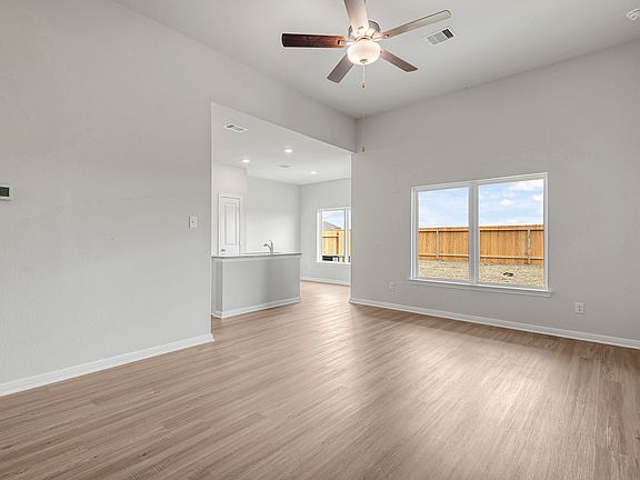 Enjoy views of the backyard from the living room and dining room