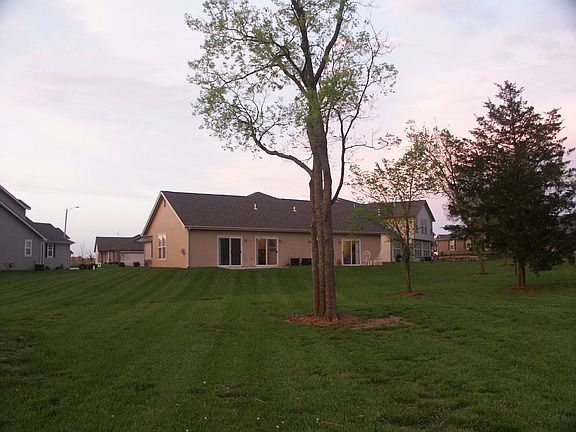 Large tree-filled lot. 