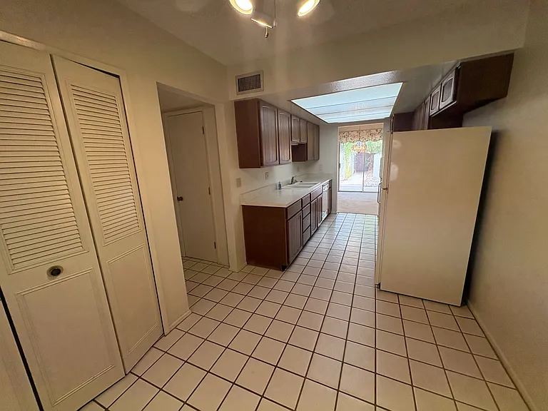 Laundry closet on left