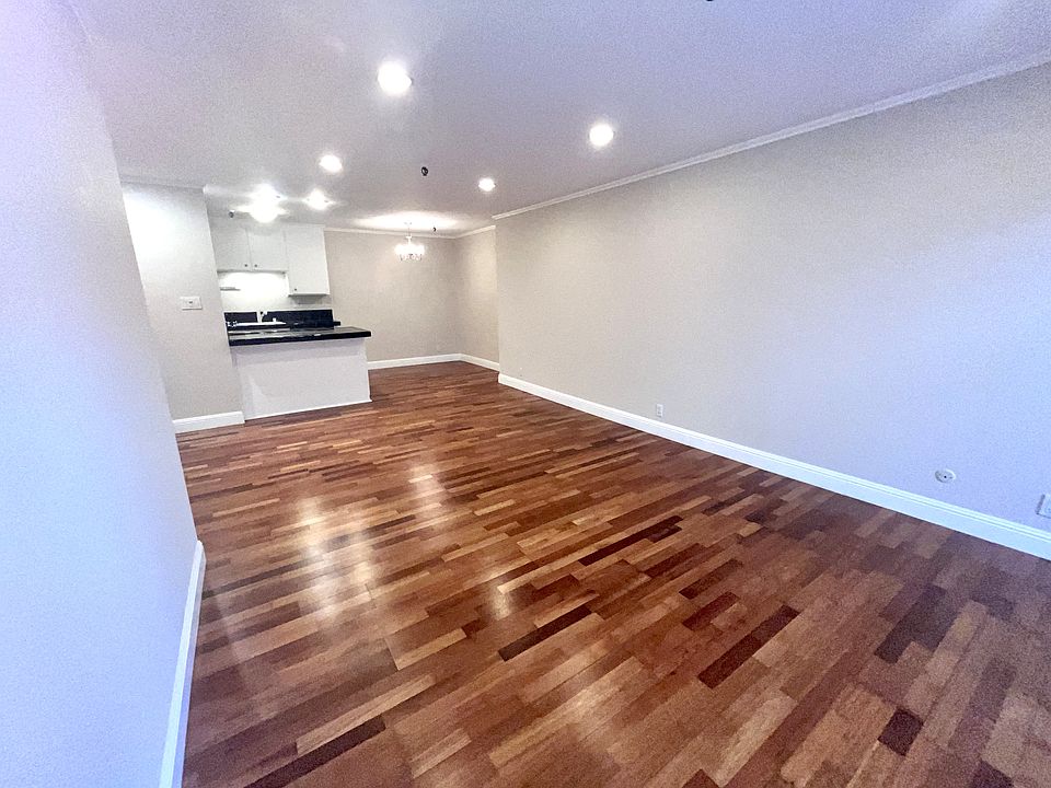 Living space looking to dining and kitchen