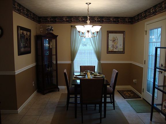 Dining Room w/ upgraded lighting and chair rail