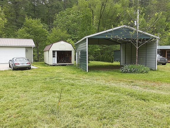 A wooden shed and metal   