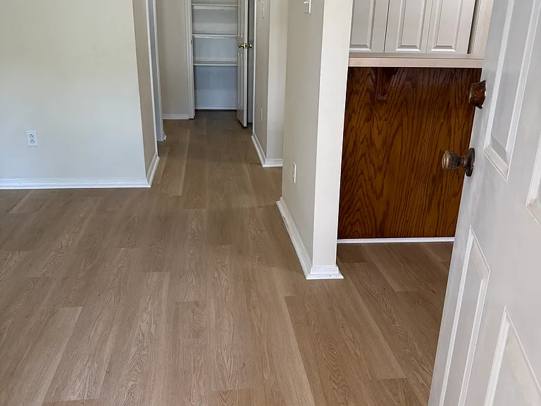 View from front door. Linen closet at far end between the bedrooms.