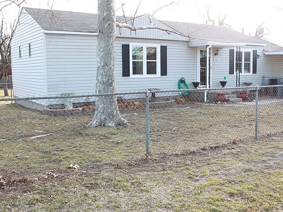 Entire yard has chain link fence. Nice big shade trees will be great in the summer. Easy maintenance siding and new vinyl windows.