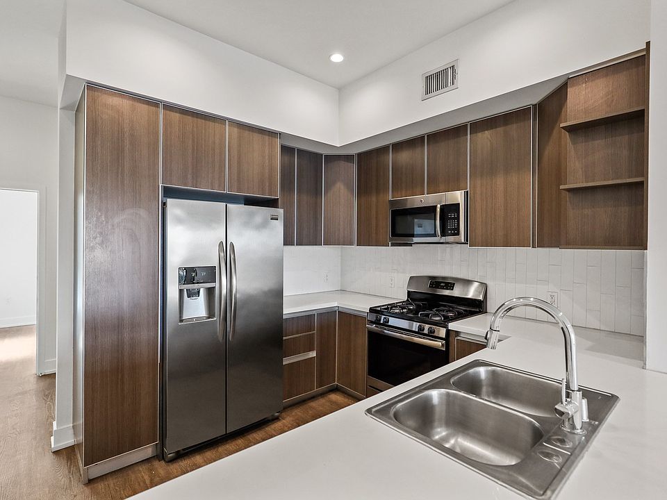 Full-Size Kitchen with Ample Cabinet Storage and Vinyl Flooring