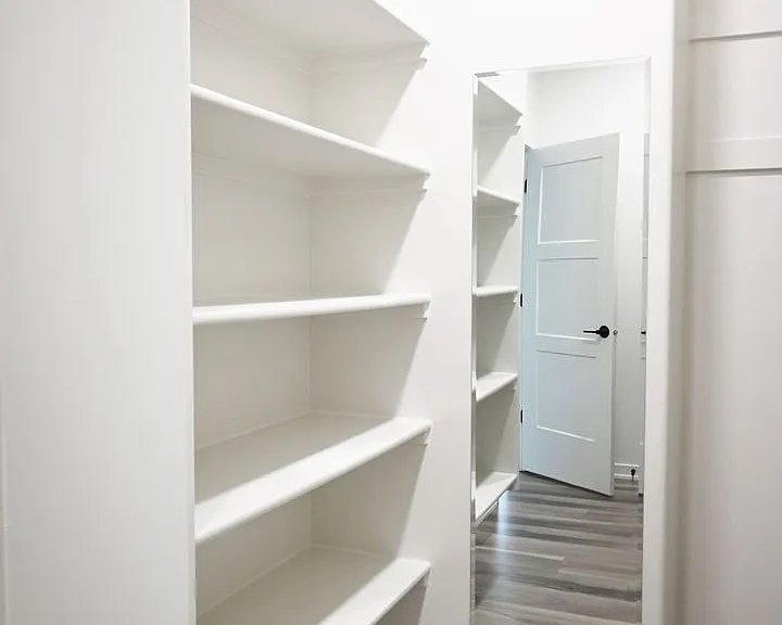 Walk-in closet in master bedroom.