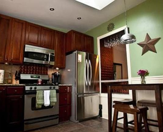 stainless steel. wall color has changed to more neutral.