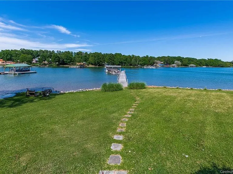Backyard with Fire Pit and Private Dock Entrance.