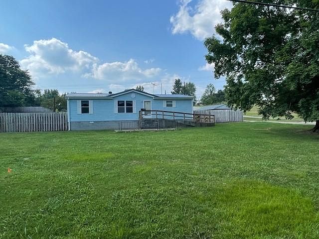Front view of house and yard & tree