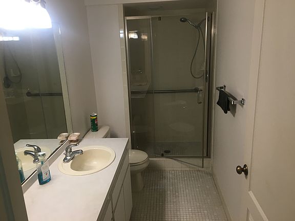 Master BA with remodeled bench shower plus handicap accessories.