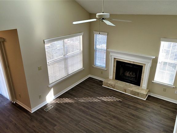 Main floor living room with door to back deck