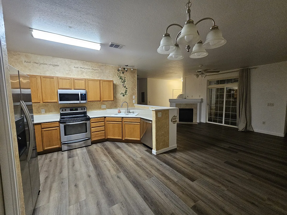 Kitchen with stainless steel appliances - 3282 E 103rd Dr