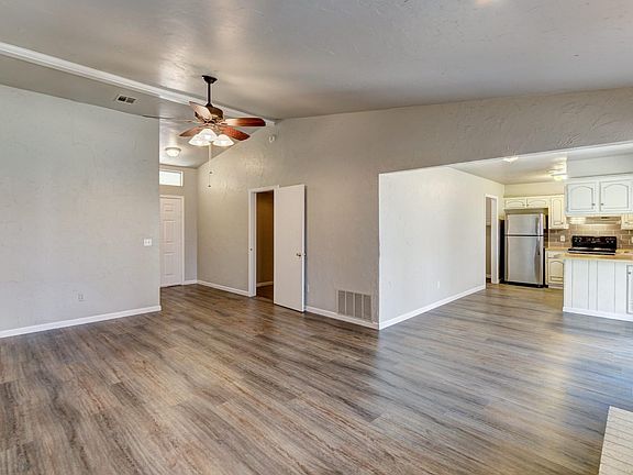 Living area - looking back to front door & into kitchen