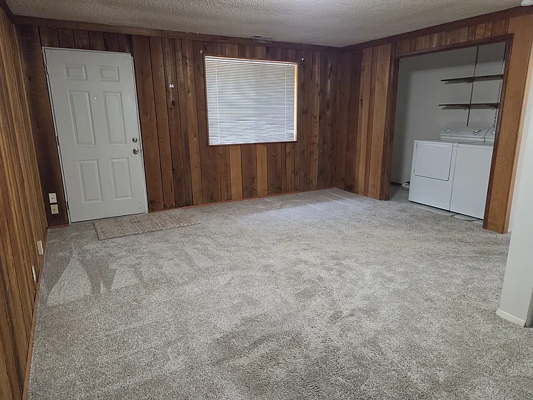 Bedroom #4 with side entrance and laundry