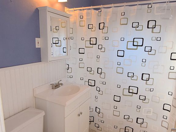 Updated bathroom with ceramic tile floor.
