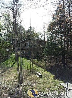 Lakeside view of the house with walkout basementL