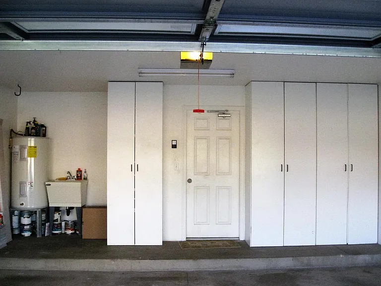 over 400 sq ft 2 car garage with built in cabinets and extra