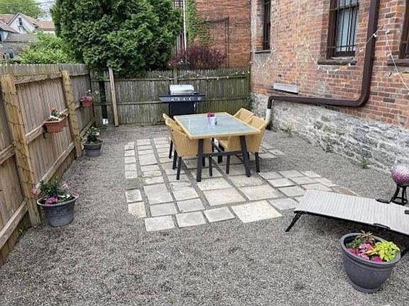 Private fenced patio perfect for outdoor dining and entertaining