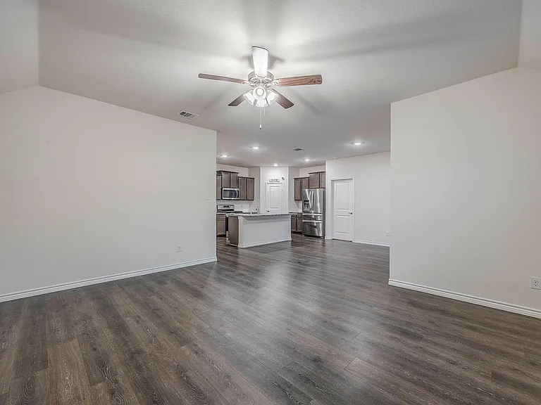 living room looking into kitchen and dining area