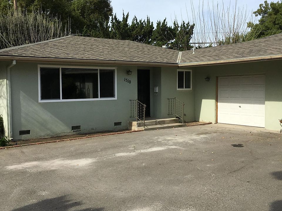 FRONT of duplex, 1 car garage, laundry in garage and extra bonus room attached w / door to backyard.