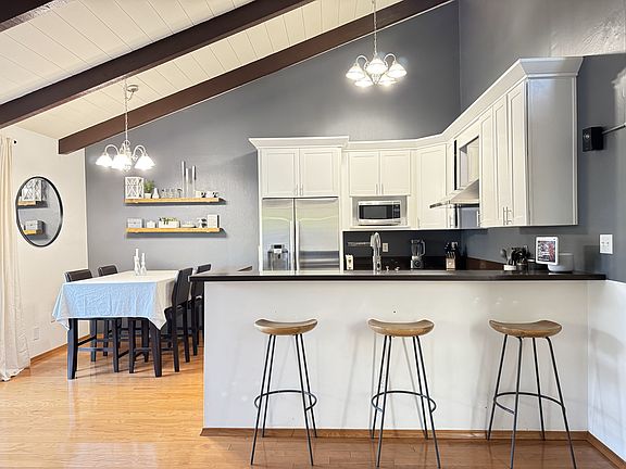 View of kitchen showing breakfast bar and dining area