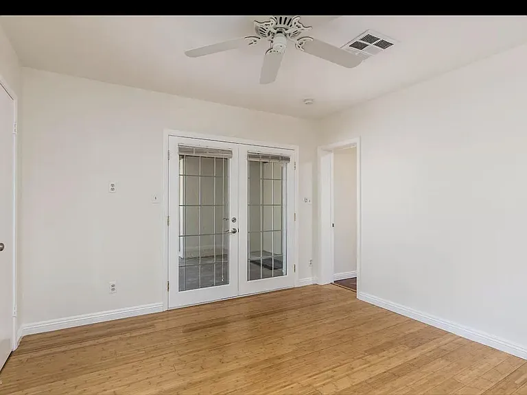 spare bedroom with patio doors