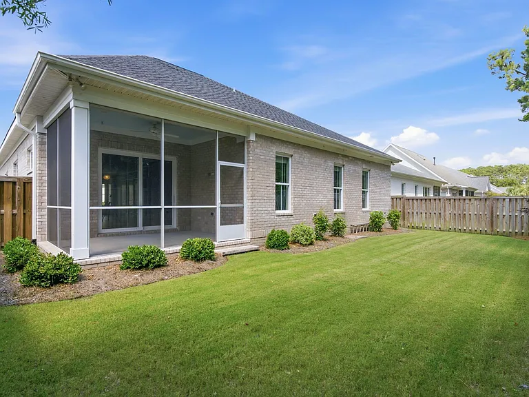 Screened-in back porch. Fully fenced-in backyard