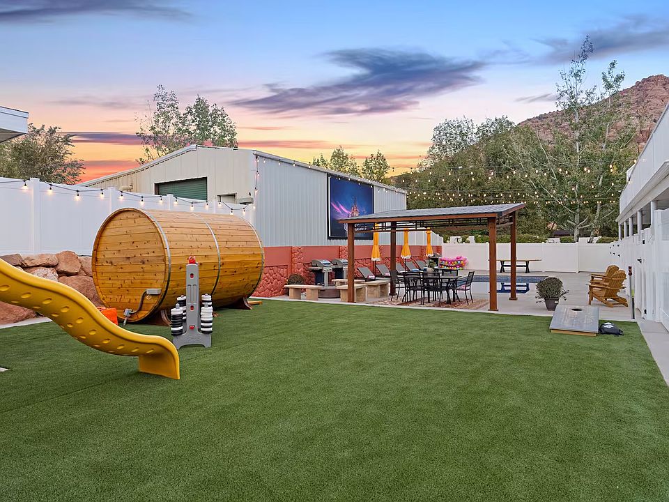 Turfed lawn & playground can be seen from the dining & grilling areas, making it easy for families to safely enjoy their time outdoors. Note: there is NO fence around the outdoor pool, however there is a gate separating the pool from your back porch.