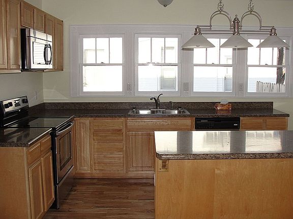 PLENTY OF NATURAL LIGHT IN THIS CUSTOM KITCHEN