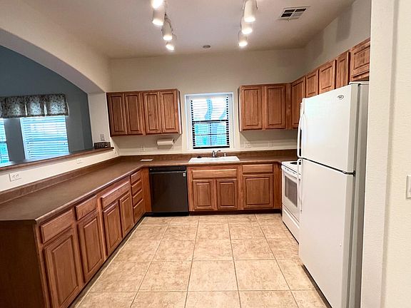 View of kitchen from garage entrance