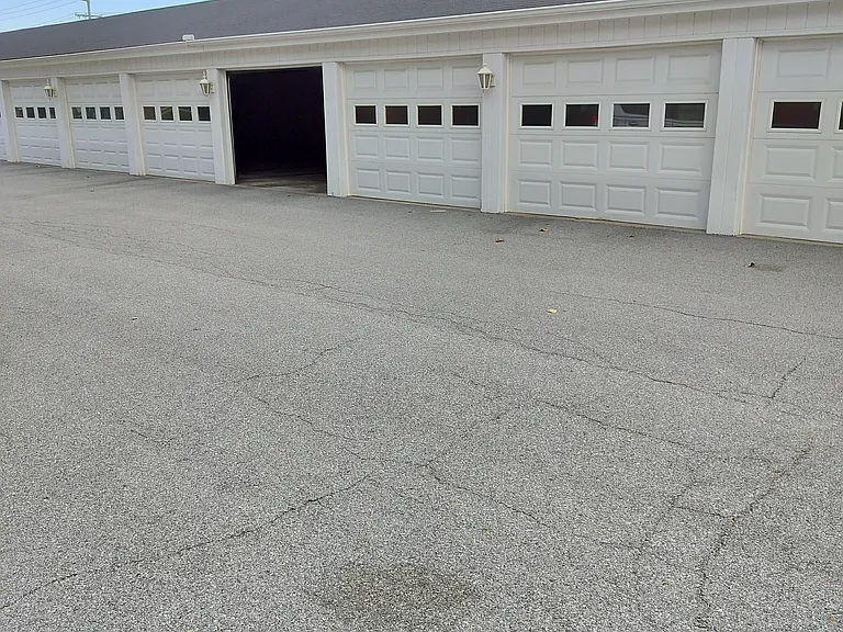 Shared garage, newer garage door opener. Private locked storage for each unit.