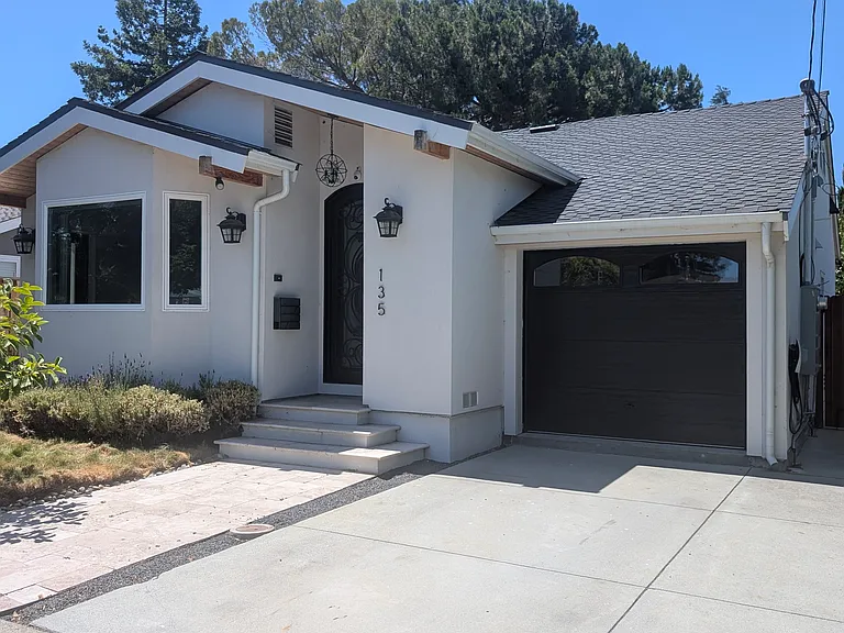 Streetview of house. Parking spot can fit a large vehicle.