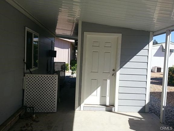 covered carport w/ shed