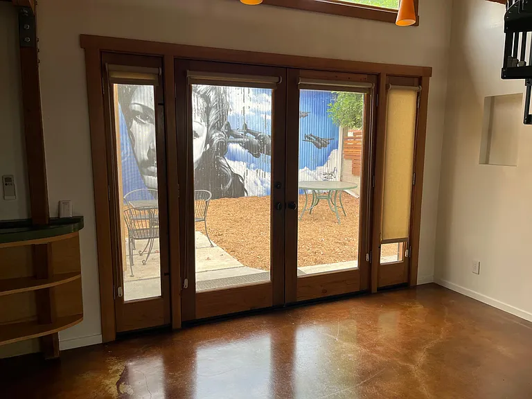 Main entrance looking out to private sitting/garden area--new amenities have been added and a new mural has been added.
