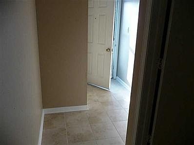 Entry. Welcome to the lake and come on inside. NEW TILE just installed through the entry, hallway and kitchen, neutral in color to coordinate with all styles