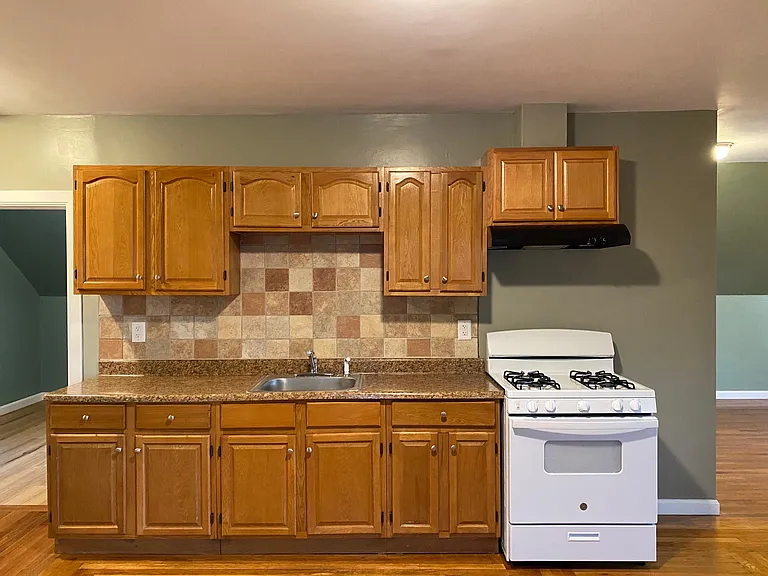 CABINETS,SINK AND STOVE.